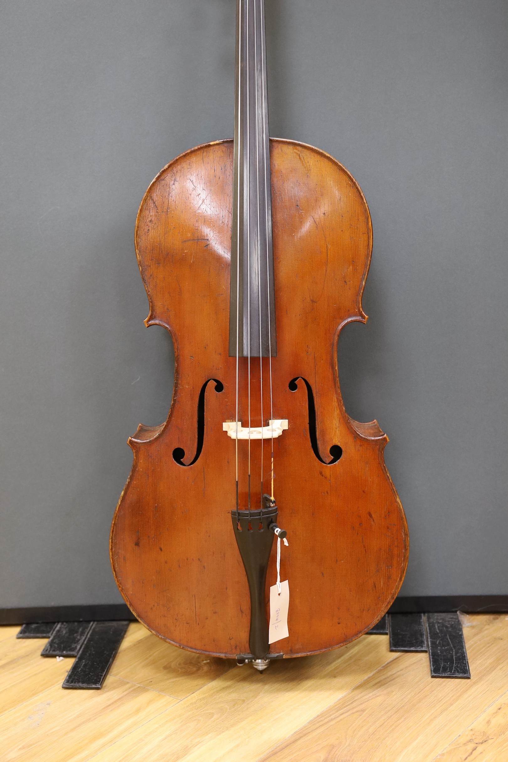 An early 20th century French half size cello, with soft case and bow
